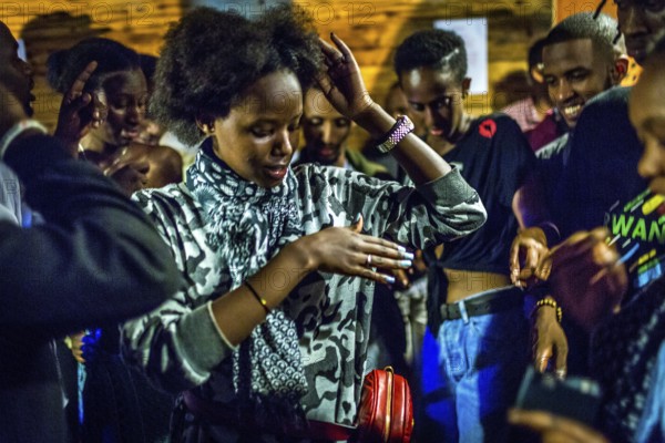 RWA RWANDA RUANDA Kigali Guests at a regular party organised by the Inema Gallery. Artists, locals
