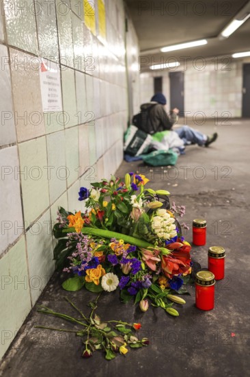 DEU Germany Germany Berlin Flowers and candles at Moritzplatz underground station, where a homeless