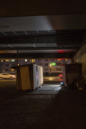DEU Germany Germany Berlin Wooden shacks financed by donations stand under the motorway bridge in