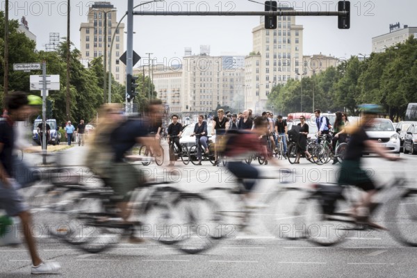 DEU Germany Germany Berlin Scene with cyclists in traffic in the capital Karl-Marx-Alle, corner of