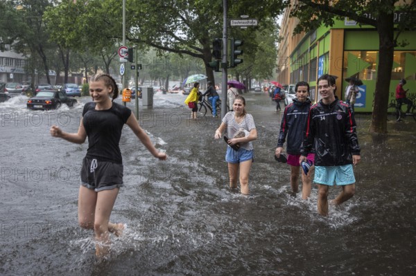 DEU Germany Germany Berlin Scene of the storm in Berlin. Young people cross the flooded