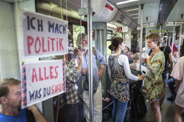 DEU Germany Germany Berlin Students discuss the G20 summit on the Berlin S-Bahn. A loose group of