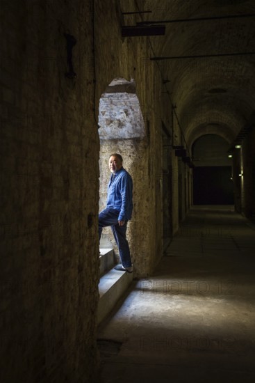 DEU Germany Germany Berlin The Chinese artist Ai Weiwei in his studio in the vaulted cellar of the