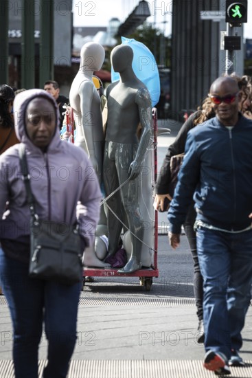 DEU Germany Germany Berlin Pedestrians crossing a street at Potsdamer Platz where mannequins are