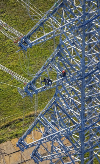 Aerial photo, construction power line Dortmund-Hagen, climber in power pylon, worker, height