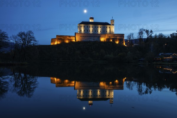 Moon over Trautenfels Castle, reflection in a lake, blue hour, near Irdning, Ennstal, Styria,