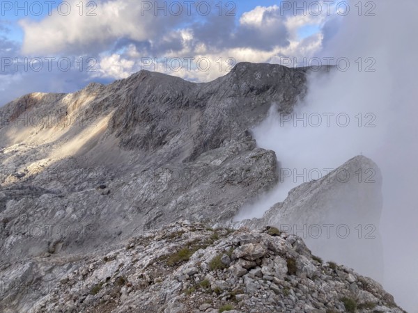 View from the summit of Wildalmkirchl with fog on the southern edge of the Steinernes Meer,