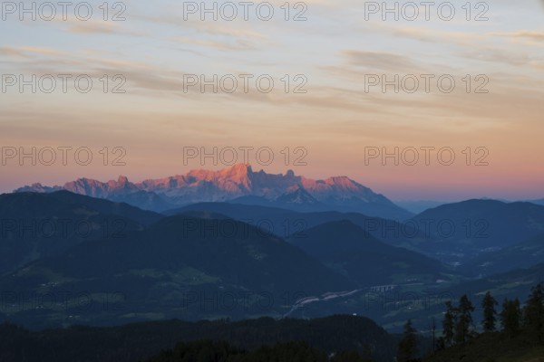 View from Mitterfeldalm to Hoher Dachstein at sunset, the Tauern motorway in the valley, Salzburg