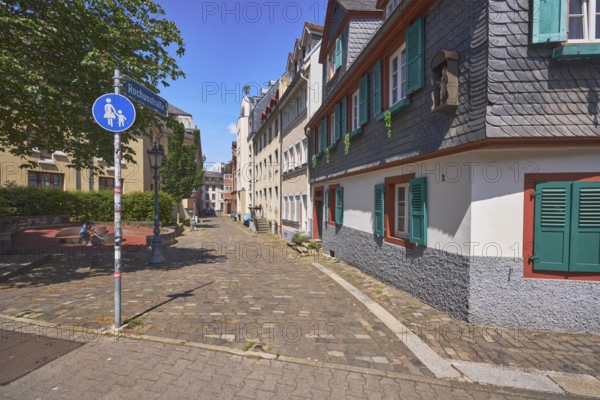 Historic buildings, houses, slate tiles, paving stone sidewalk, road signs special path for