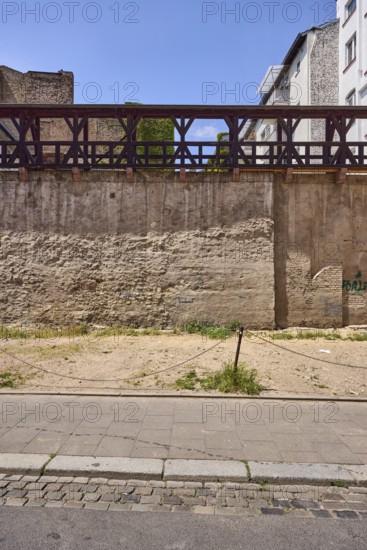 City fortification, historic city wall, general architecture, houses, parking lot, barrier bollard,