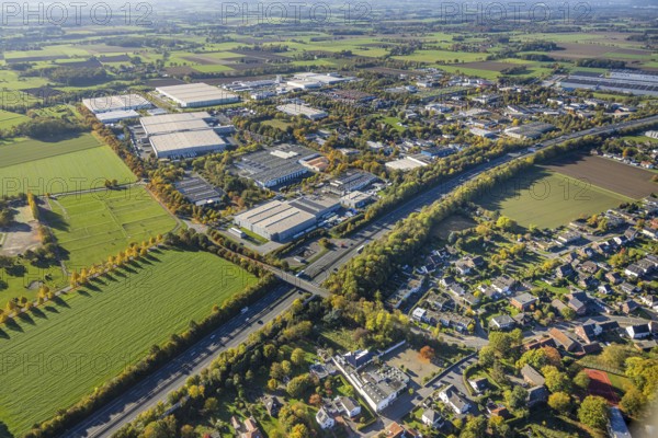 Aerial view, Oberster Kamp industrial estate on the A2 motorway, meadow area surrounded by autumn