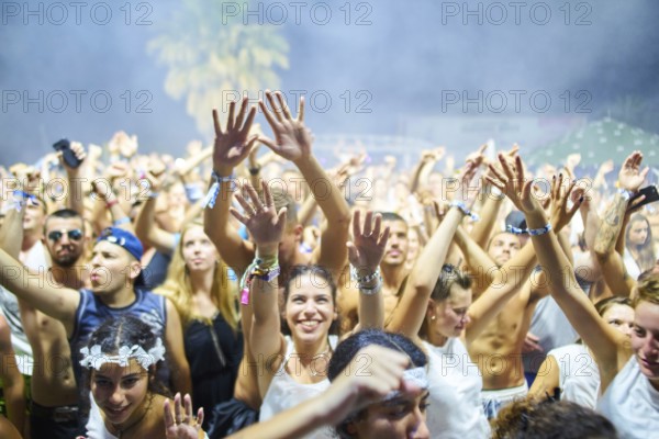 EDITORIAL and NEWS ONLY, festival crowd cheering towards stage of rare moment of joint DJ back to