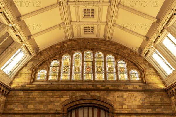 London, United Kingdom - 15 May 2025: Detailed close-up of the beautiful stained glass arched