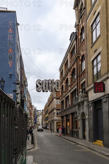London, United Kingdom - 15 May 2025: The classic London streetscape featuring the iconic soho