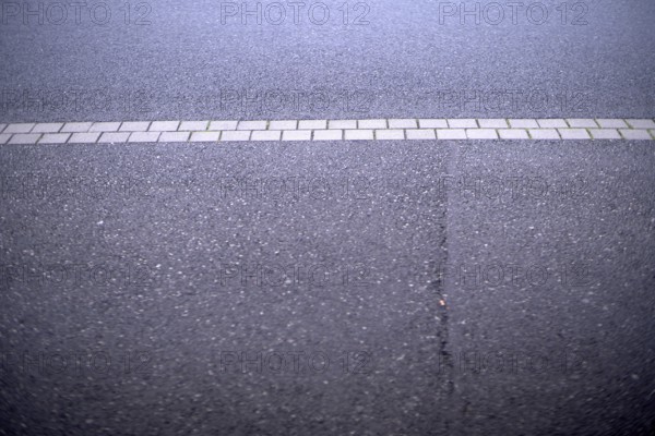 Weather conditions caused a crack in the street asphalt requiring public maintainance financed by