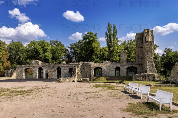 Ruins with stone walls, benches and trees under a clear sky, The Niedeck Ruins in Arnstadt