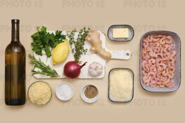 Ingredients for making risoni pasta with shrimp including white wine, parsley, lemon, thyme,