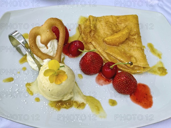 Calorie dessert dessert cream with a scoop of vanilla ice cream fruits strawberries cherries,