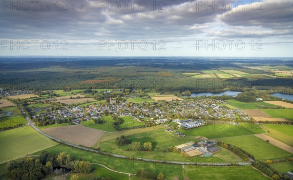 Aerial view, residential area district of Kessel with St. Stephen's Church and Reichswald, blue sky
