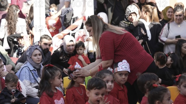 Children celebrate the 102nd anniversary of the Republic Day of Turkey, a national holiday