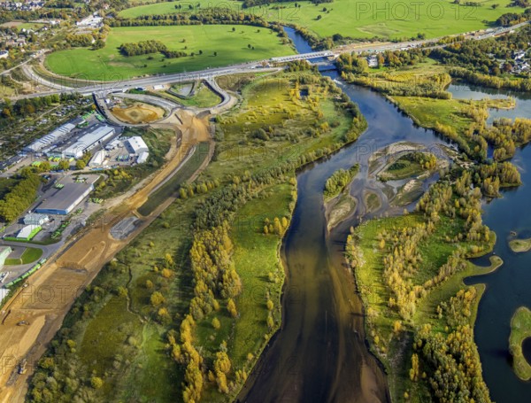 Aerial view, lip embankment, construction site and new building extension and feeder federal road