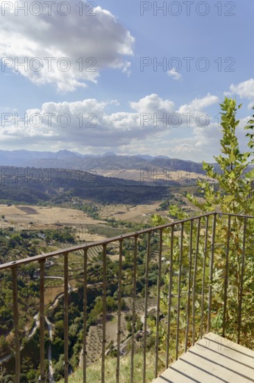 Ronda, malaga, spain Viewpoint balcony overlooking the vast valley with mountains and fields under