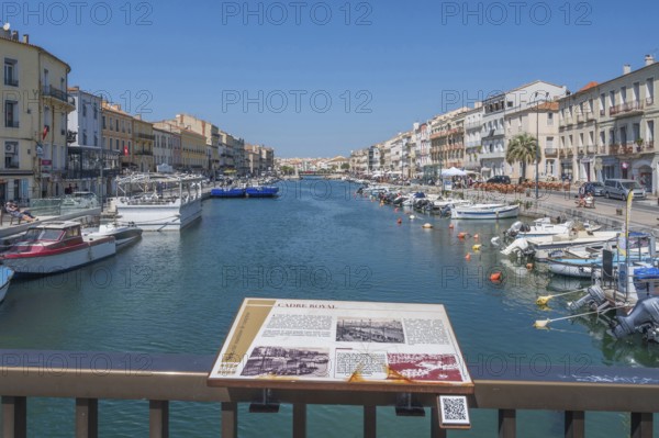 The Canal de Sete, formerly Canal Royal, stretches between the historic house facades, with an