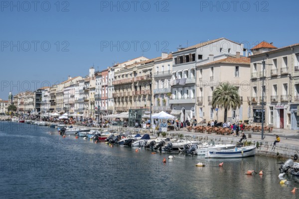 The lively promenade of Quai Leopold Suquet along the Canal de Sete, formerly Canal Royal, with a