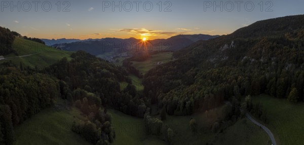 Sunset between the first and second Jura ranges, drone shot, Breitehöchi, Mümliswil, Solothurn,