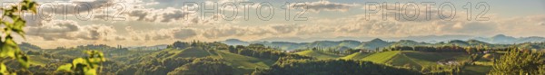Rolling hills and dramatic clouds create a scenic vista at sunset, Gamlitz, Austria