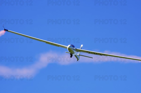 An SZD-59-1 ACRO glider, registration D-1138, during a demonstration as part of an air show at the