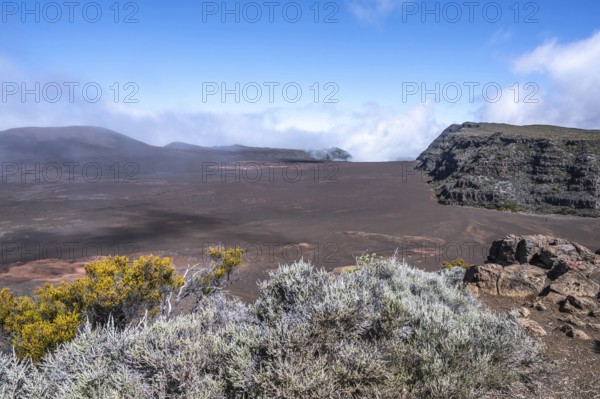 View from Pas de Bellecombe on the Route du Volcan of the Enclos Fouque caldera with rust-red