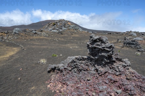 The barren volcanic desert of the Plaine des Sables along the Route du Volcan is dominated by