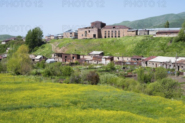 Rural village on green hills with scattered buildings and fields, Kechut, Kushchi, Kush-Bilyak,