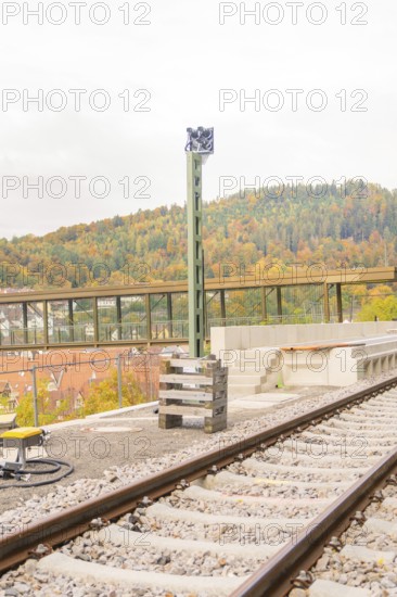 Railway tracks in autumn with a high pole next to them, Signalbau an der Hermann Hessebahn, Calw,