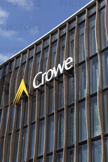 Crowe BPG, audit and consulting firm, logo on modern wooden façade with larch pilasters,