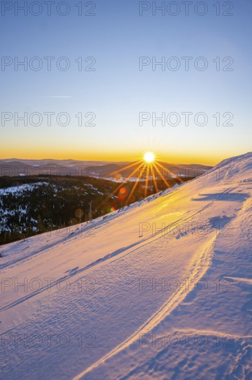 Sunrise over the hills of czech republic from Mount Lusen wth the view over the hills of the