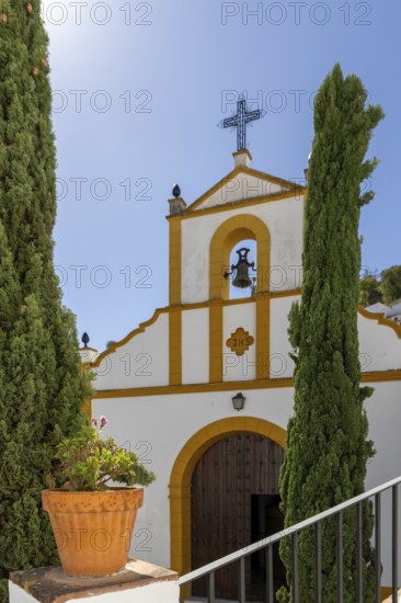 On the road to the white villages. Paths and narrow streets of a historic old town. Ermita de San