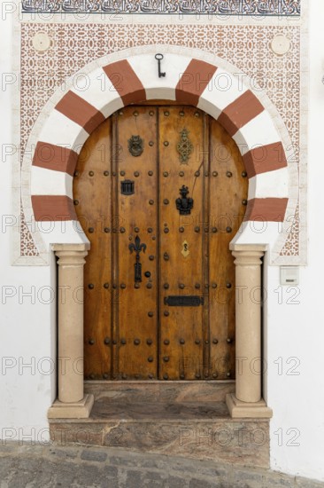 On the road to the white villages. Beautiful doors of the historic old town in Setenil de las