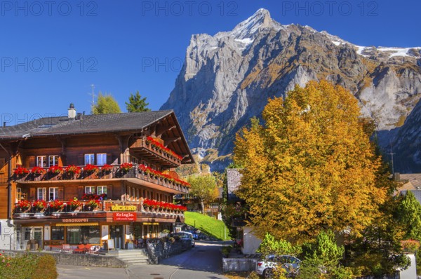 Village bakery with Wetterhorn 3690m in autumn, Grindelwald, Lütschinental, Bernese Oberland,