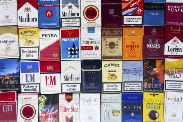 PRAGUE, CZECH REPUBLIC - MARCH 25: Many packs of different cigarettes photographed with top view