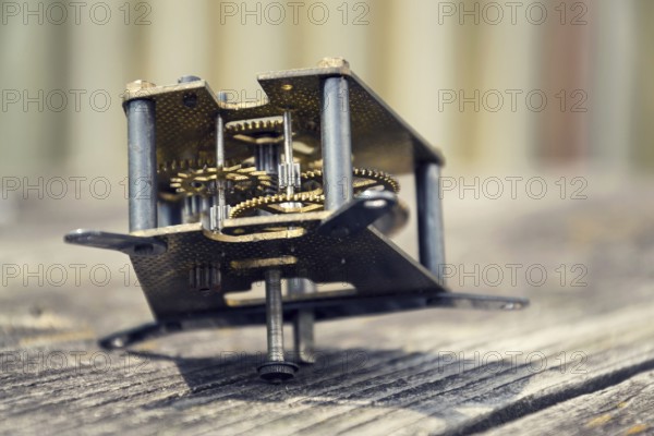 Retro vintage clockwork movement watch mechanism on wood Prague, Czech republic