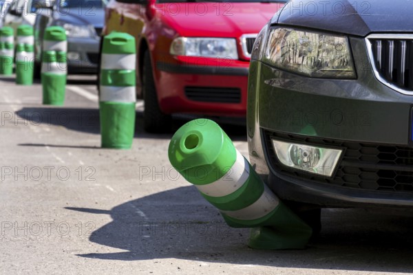 Car bending white and green safety traffic post with front bumper, wrong parking, car insurance,