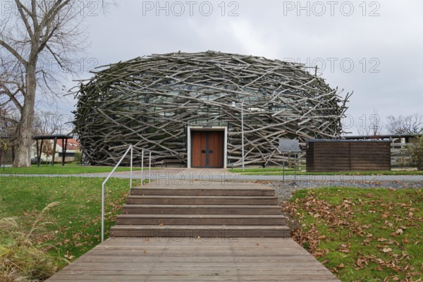 Capi hnizdo Storks Nest riding arena covered with wood resembling a giant birds nest on November