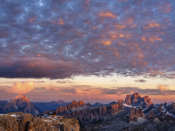 Alpenglühen, Rifugio Lagazuoi and rugged Dolomite peaks at sunset, Dolomites, Alps, Belluno