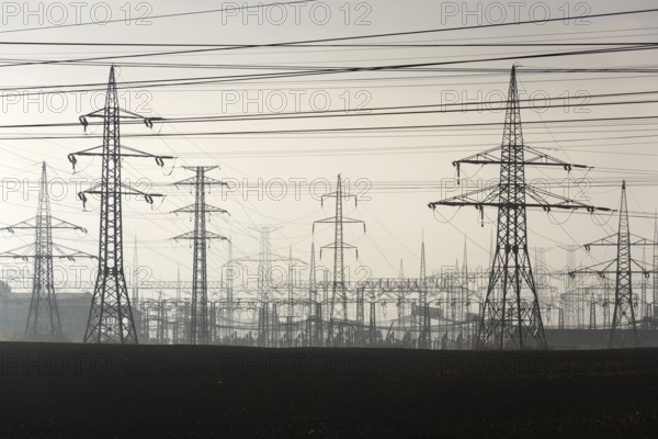 Electricity pylons leading from distribution power station Prague Czech republic