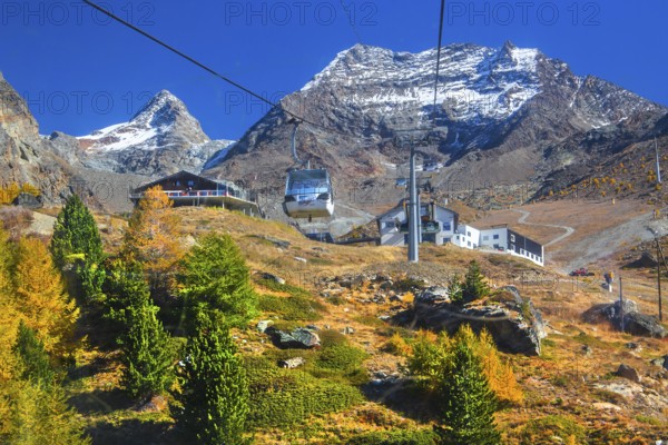 Hohsaas cable car in front of Kreuzboden mountain station with Fletschhorn 3986m in autumn,