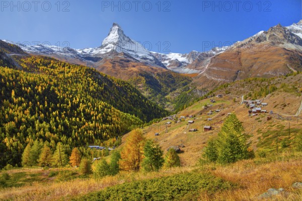 Landscape below the Sunnegga with hamlet of Findeln and Matterhorn 4478 m in autumn, Zermatt,