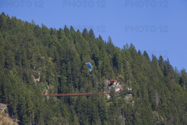 Suspension bridge on the Sunnenseit'n-Weg hiking trail, in autumn, Neustift im Stubai Valley,