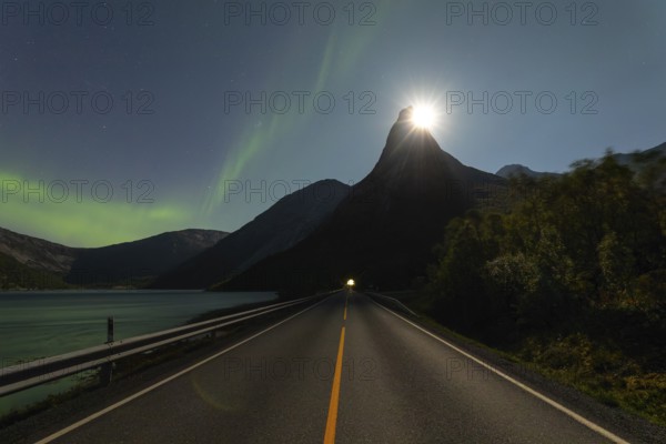 National mountain of Norway, Stetind in the Nordland under auroras and with a full moon shining